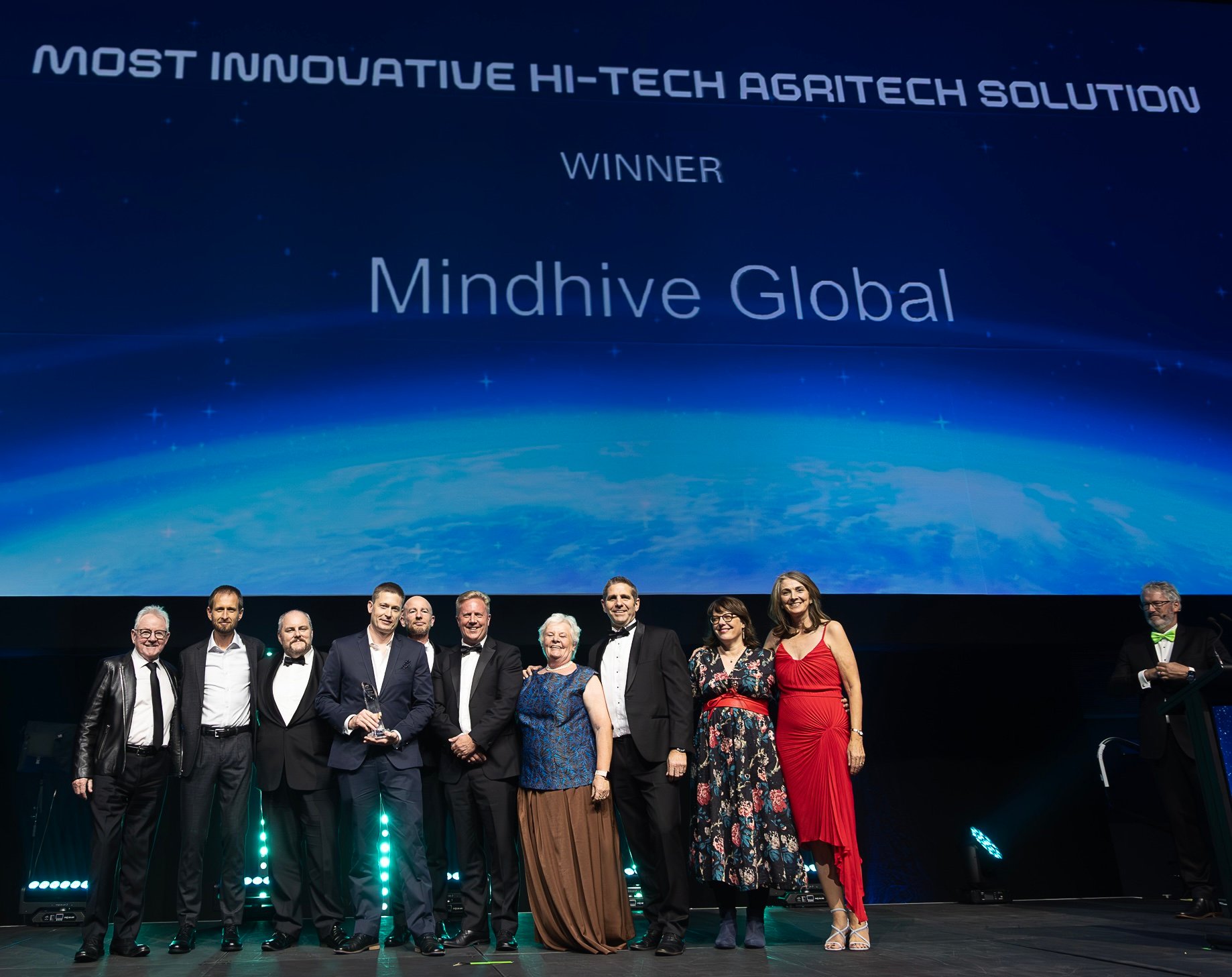 Mindhive Global team celebrating on stage after winning the Most Innovative Hi-Tech Agritech Solution award at the 2025 NZ Hi-Tech Awards.
