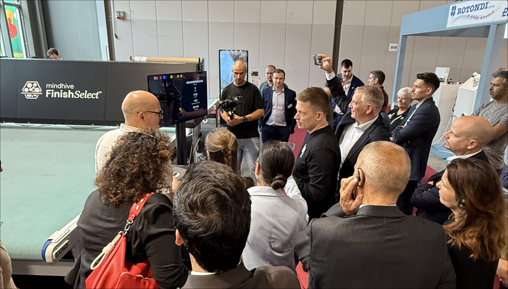 Mindhive, Mind, and Zünd showcasing the Dectura integrated workflow with engaged visitors at SIMAC 2025 Milan