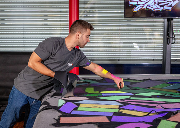   FinishSelect™ defect map overlaid on finished leather with color-coded zones guiding cutting placement for maximum material yield